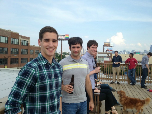DMC engineers relax and drink beers on the Chicago office roof deck.