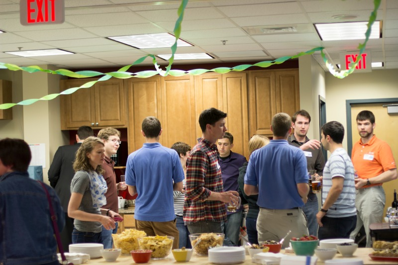 DMC employees congregate in the kitchen for food and drinks.