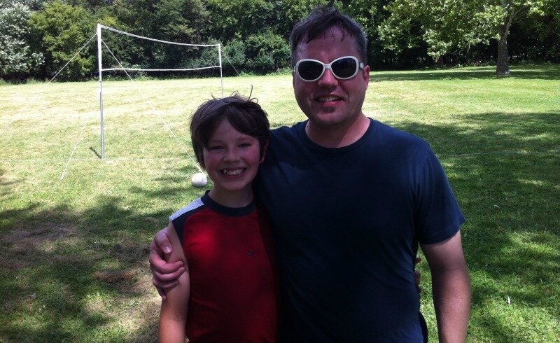 DMC Chicago engineer John Toljanic and his son play volleyball.