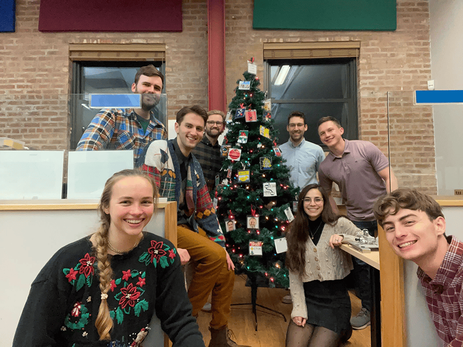 Group Photo Around the Decorated Tree