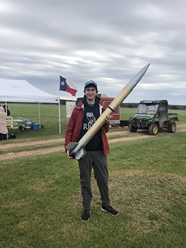 Teddy Hoisington Eclipse holding rocket
