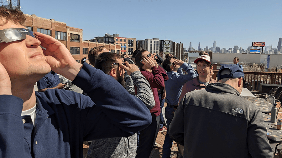 Chicago DMCers looking up at the Solar Eclipse