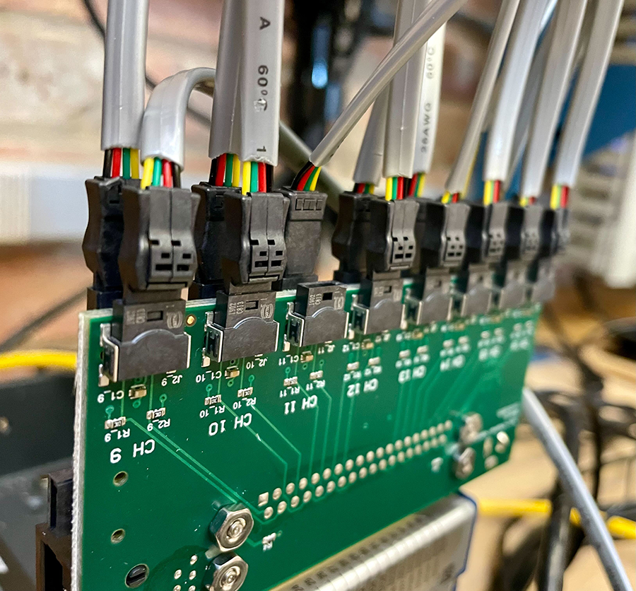 One of the custom PCBs with sensor cables populated