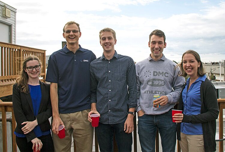 Photo of new hires at DMC's 21st birthday party.