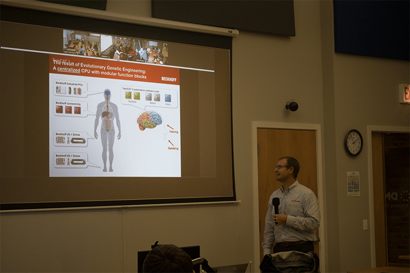 Photo of Beckhoff presentation slide -- The results of Evolutionary Genetic Engineering: A centralized CPU with modular function blocks.