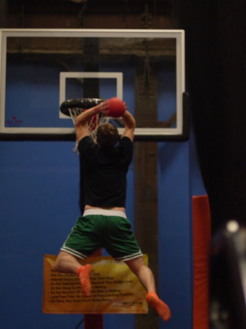 DMC Boston engineer slam dunks at Sky Zone.