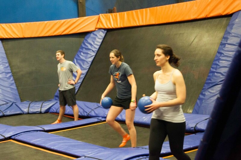 The group prepares for a game of dodgeball at SkyZone.