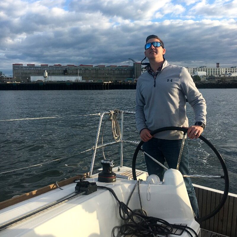 Photo of Dan captaining a DMC boat outing.