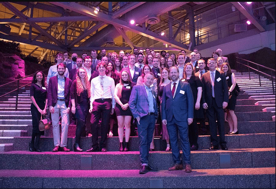 DMC's Chicago team poses for a group photo on a staircase.