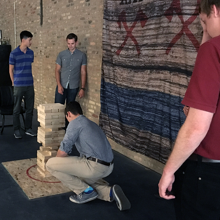 Christian Owen plays giant Jenga at Thunderbolt Axe Throwing in Chicago.