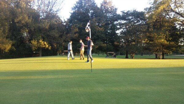 DMC engineers hit around the ball at a local golf course.