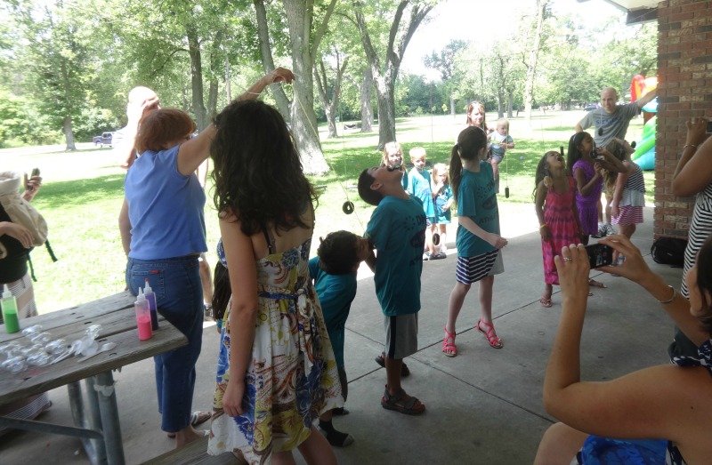 DMC employees' children engage in a donut eating contest in Chicago.