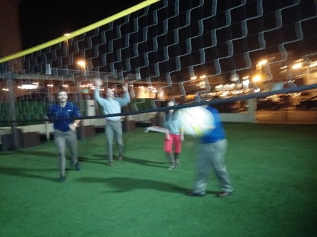 DMC Denver engineers and admin enjoy an afterwork volleyball game in December.