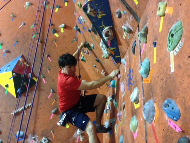DMC engineer, Jimmy, scales a wall at Thrill Seekers in Denver.