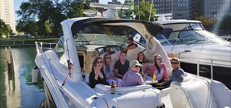 Photo of DMC employees and friends relaxing on Frank's boat.