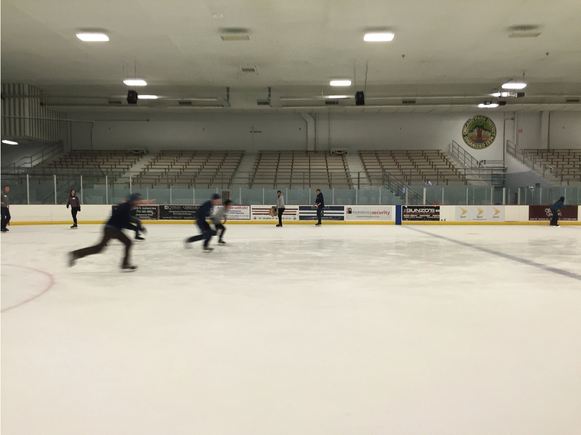 An animated GIF of employees having an ice skating race at the ADCM
