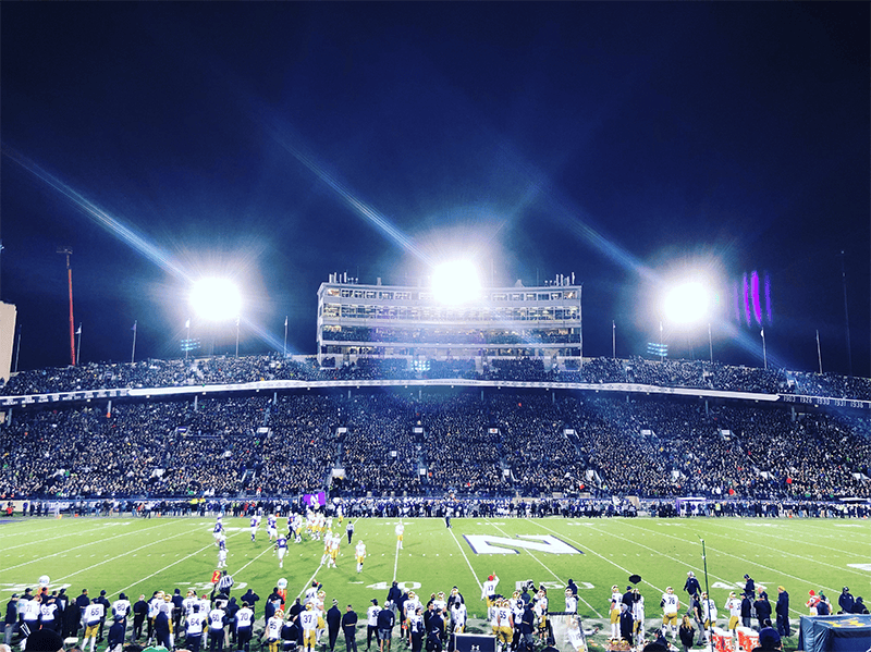 Photo of football players on the field playing