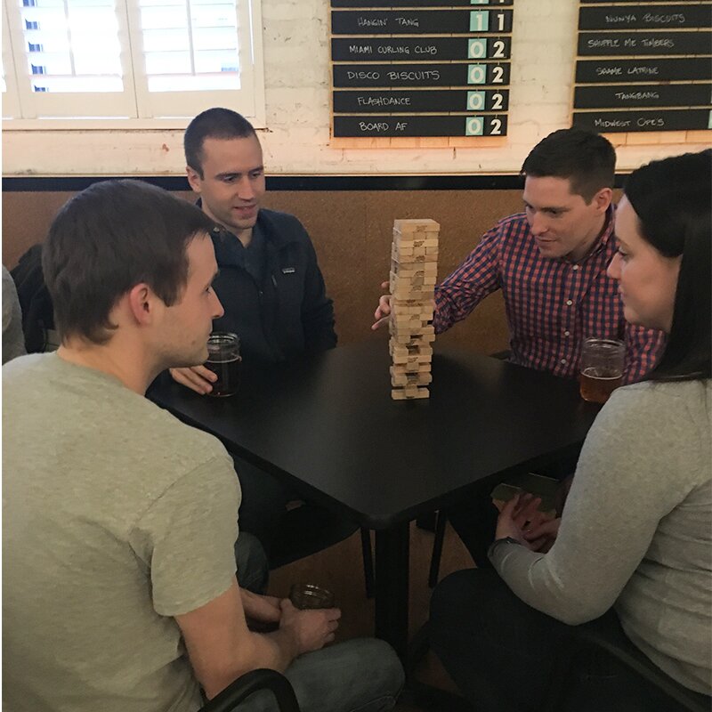 Playing Jenga at The Royal Palms Shuffleboard Club.