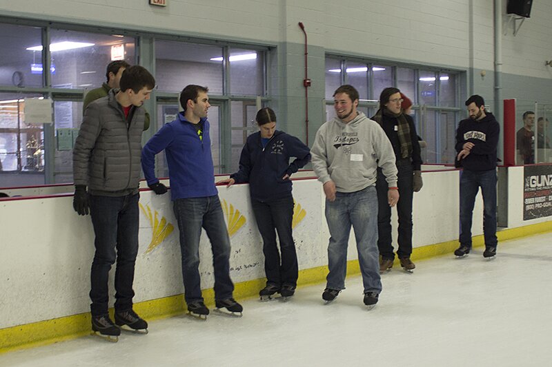 DMC Chicago employees socializing on the ice rink