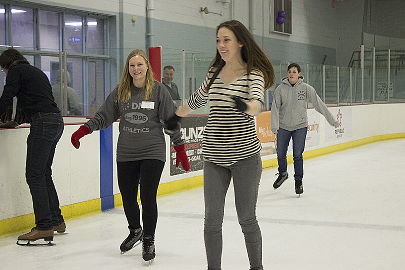 DMC Chicago employees ice skating during the All Day Company Meeting