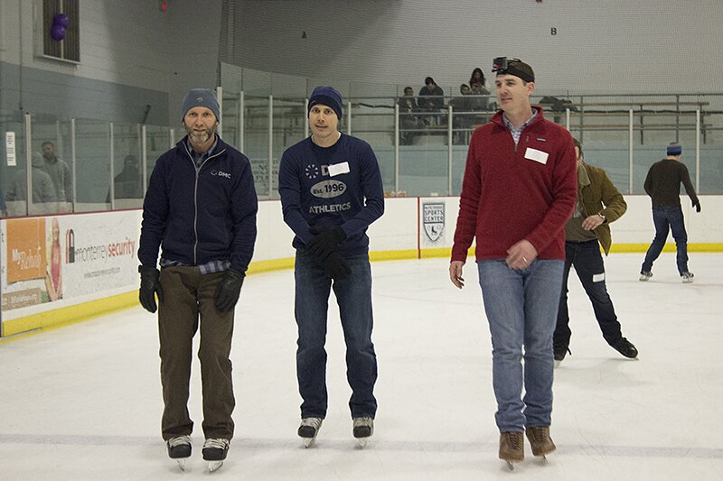 DMC Chicago employees ice skating during the All Day Company Meeting