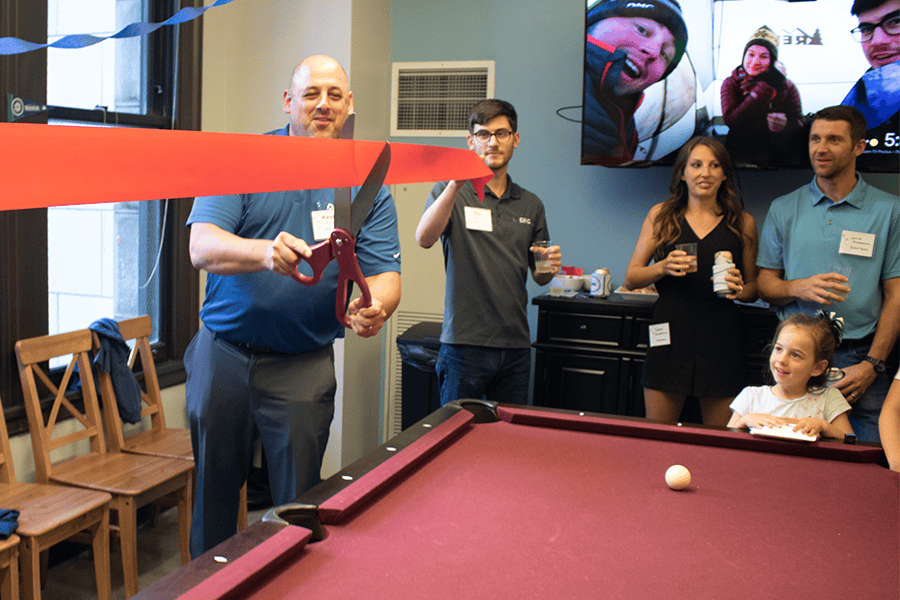 Kevin Ferrigno cuts the ribbon.