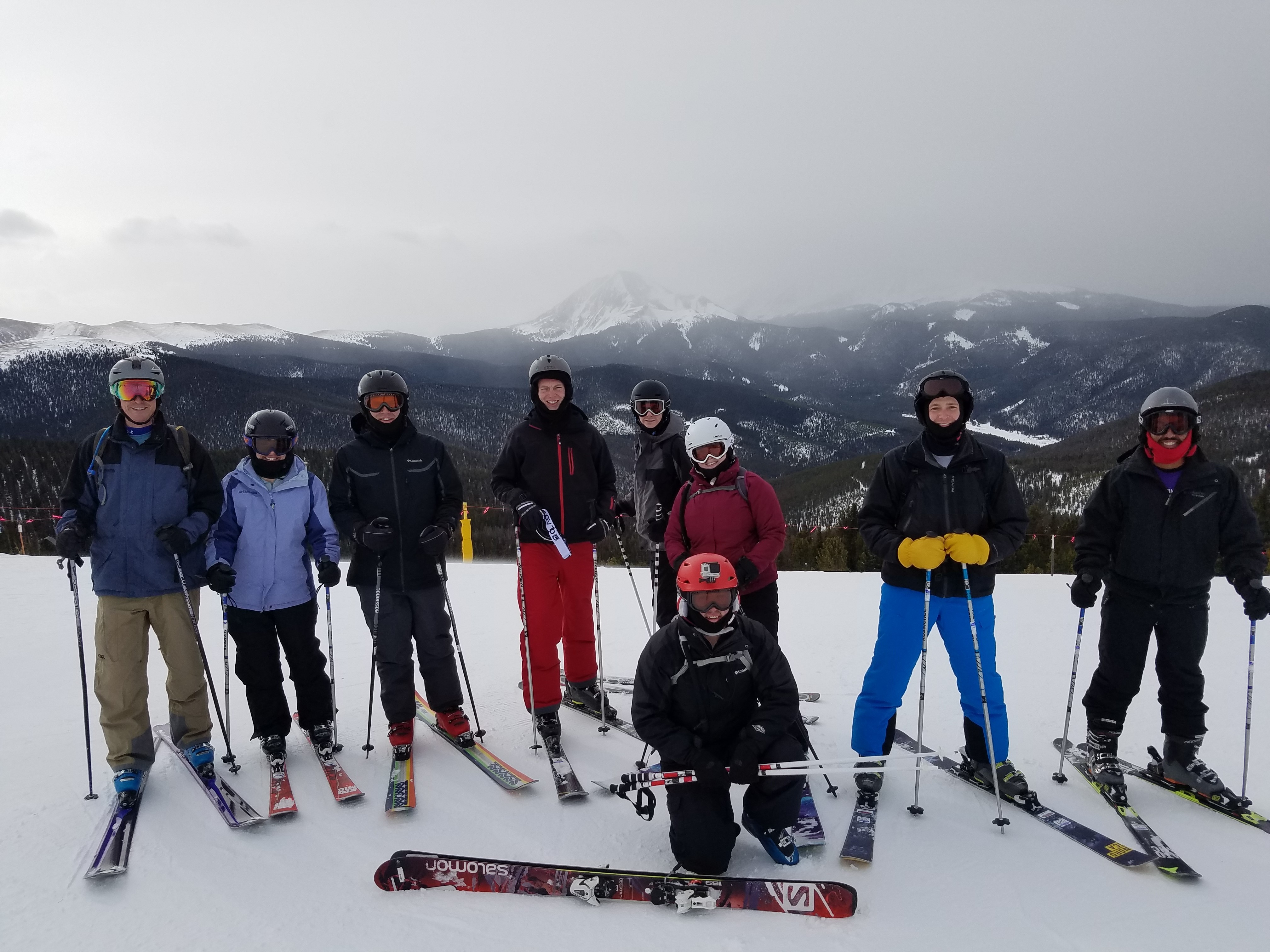 Group photo of DMCers at the top a mountain at Keystone.