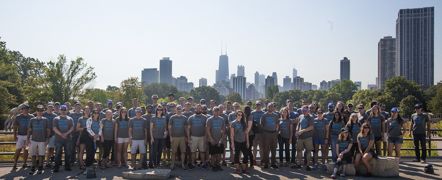 Group photo in front of the Chicago skyline at the Lincoln Park Zoo