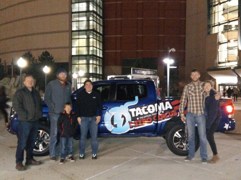 Some of DMC's Denver office and their guests posing outside of the stadium at Nitro Circus