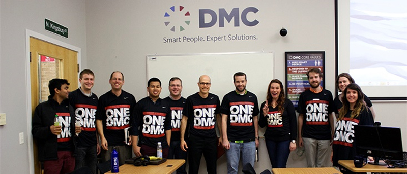 Some of DMC's Chicago office wearing their OneDMC shirts.
