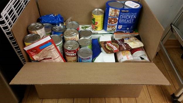 Photo of nonperishable food items collected for the Thanksgiving food drive