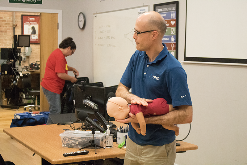 Tim Jager trains for CPR on an infant.