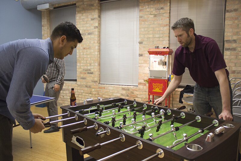 Tim and Chris playing foosball