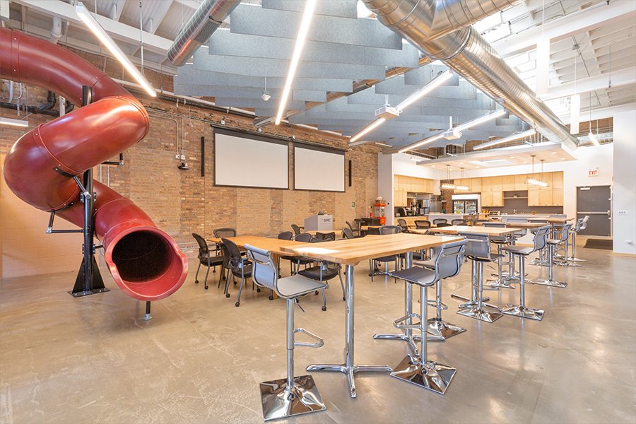 DMC's conference room features a spiral tube slide