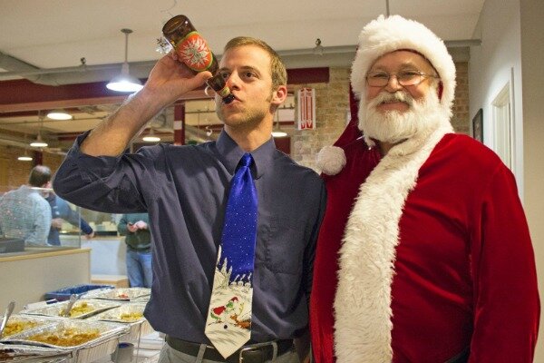 DMC engineer, Mark, throws back a beer with Santa.