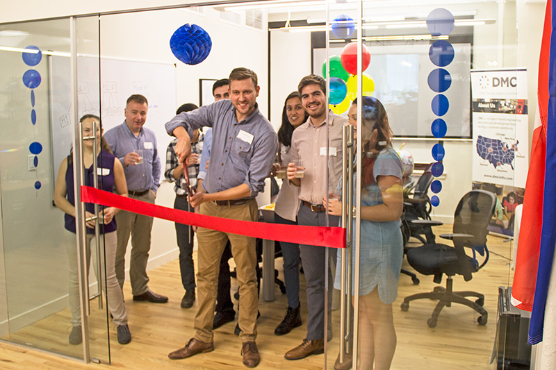 DMC cut the red ribbon to open their New York office