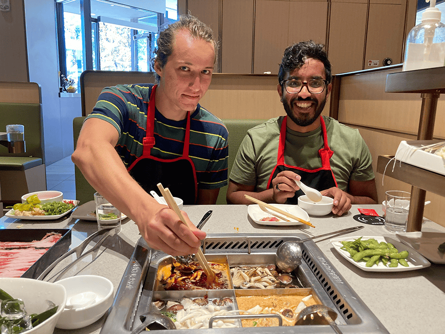 DMC's San Diego Team eating hot pot.