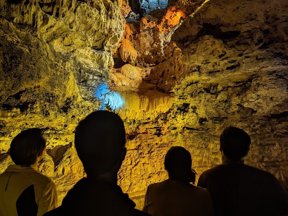 A group of people on a cave tour