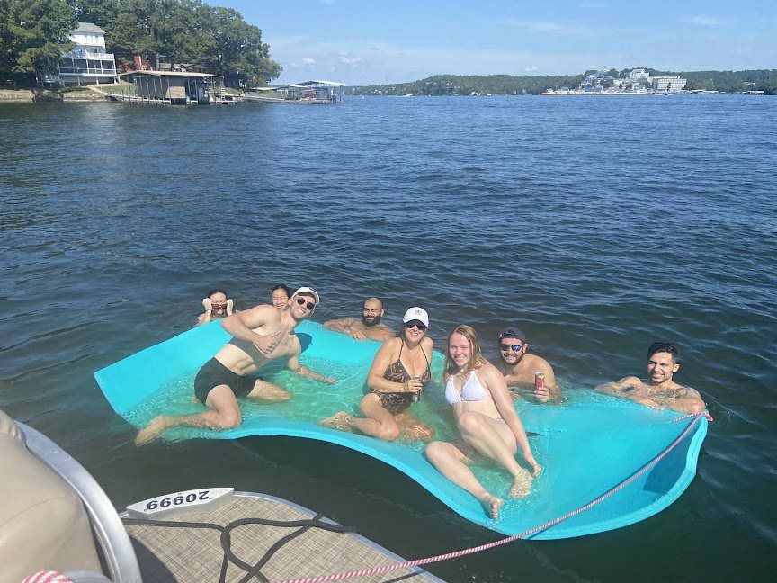 A group of people relaxing in a lake.