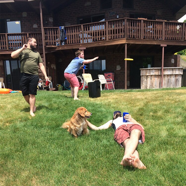 Photo of Phil, Tim H, Adam and Wiskie out in the yard.